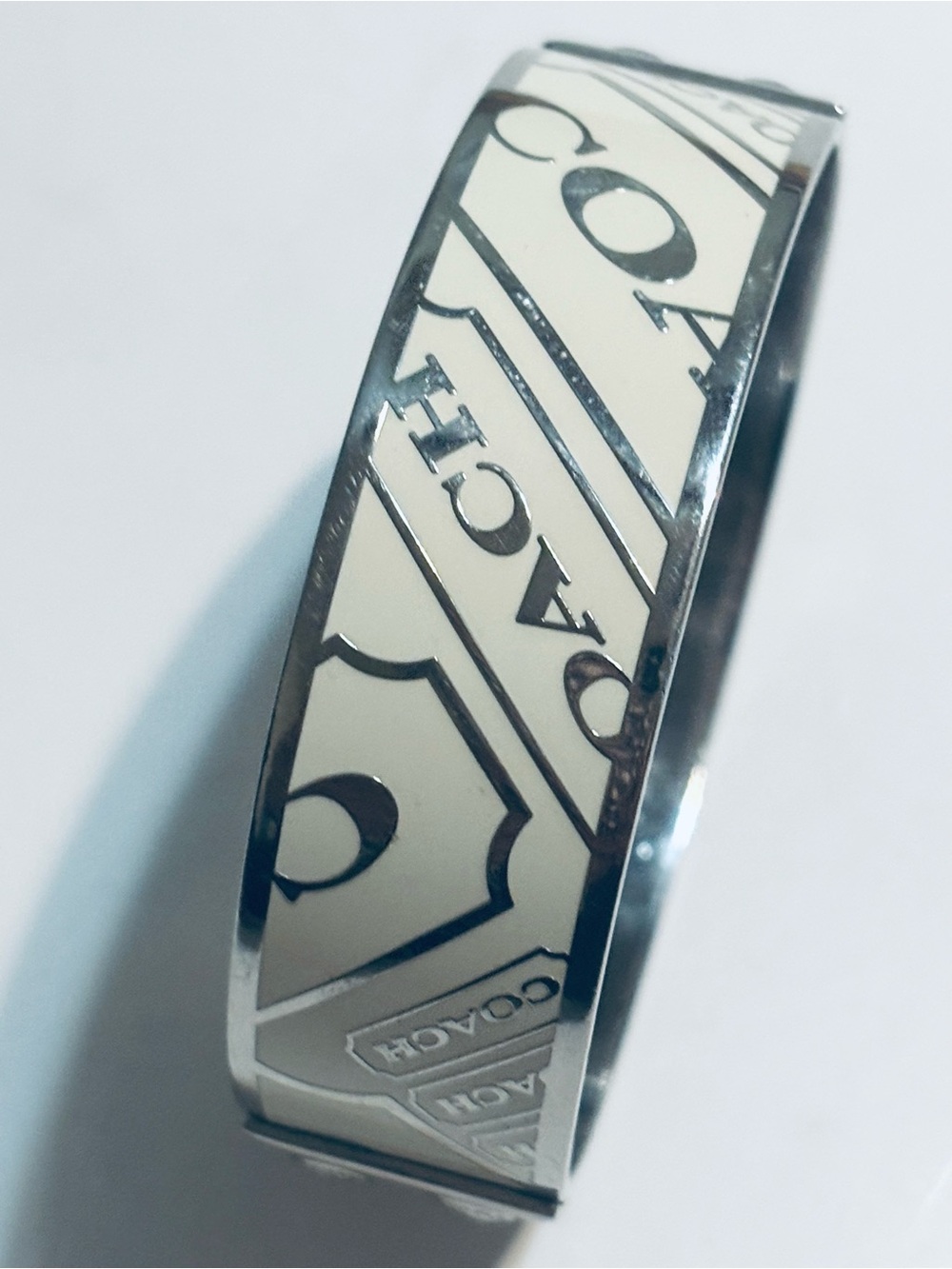 Coach Silver-Tone Bracelet with Cream Logo Panel